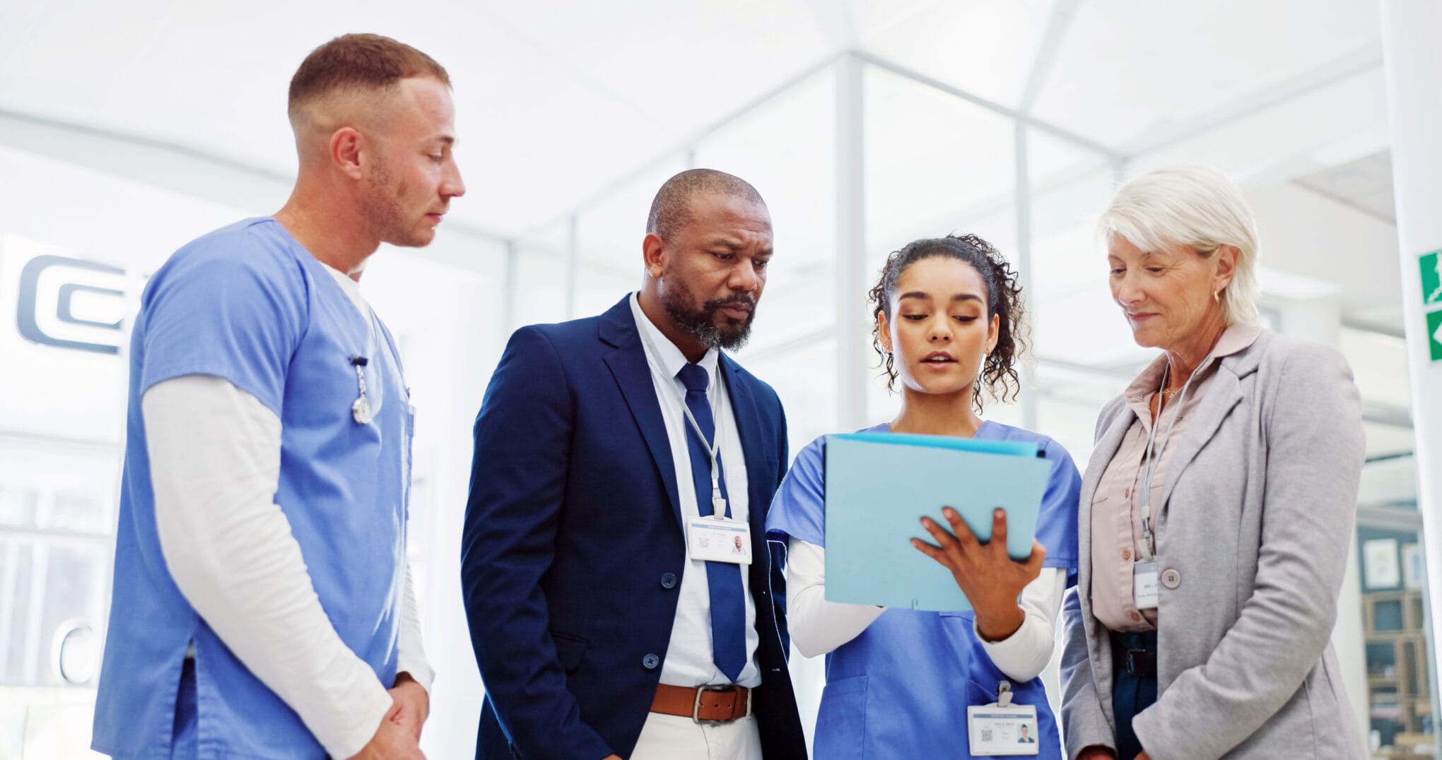 Doctors reviewing documents in a hospital meeting