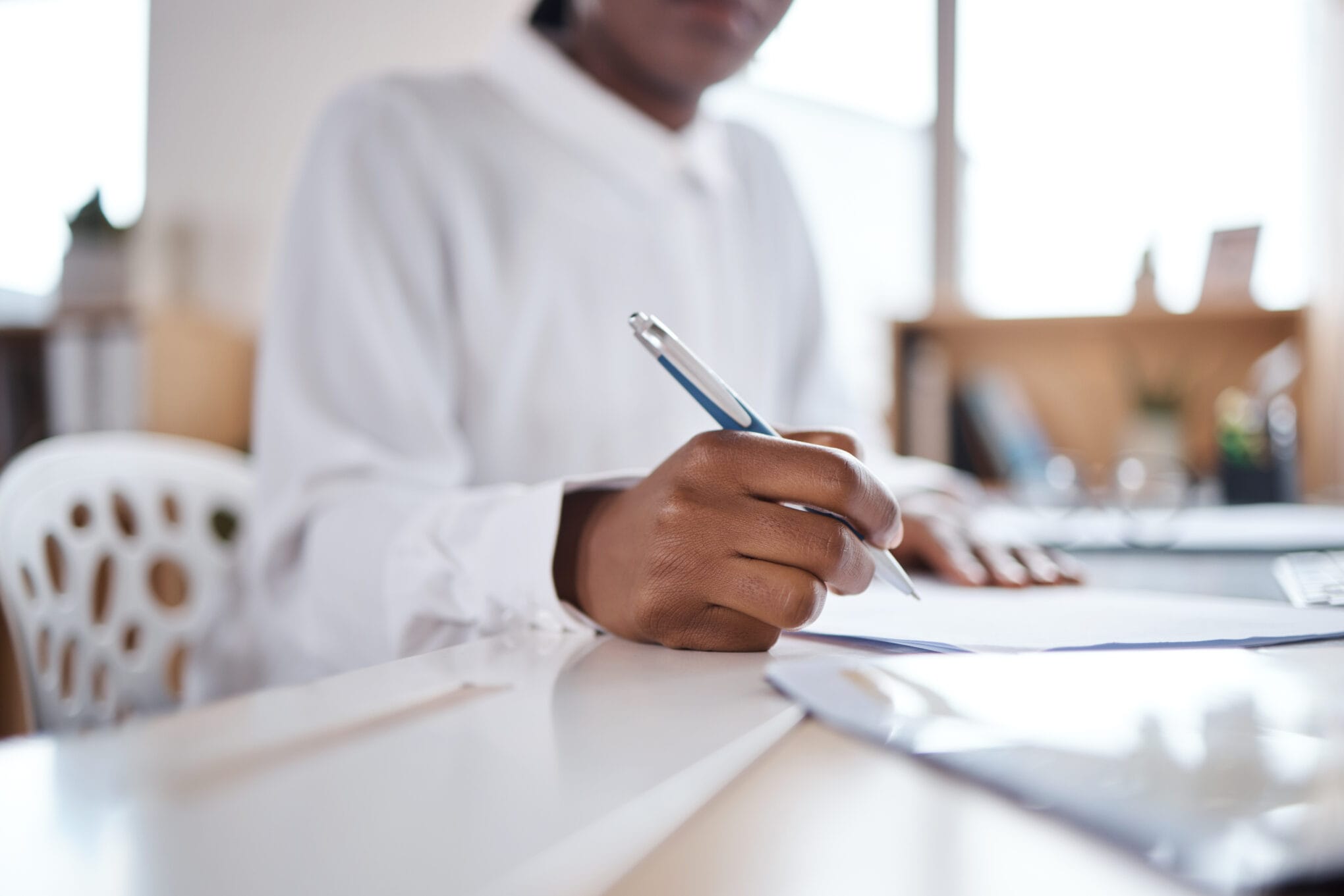 Businesswoman completing compliance paperwork